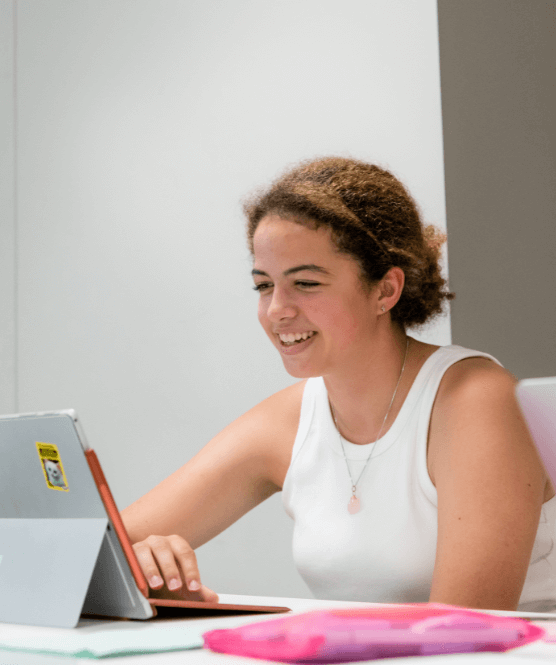 Student writing an essay competition entry