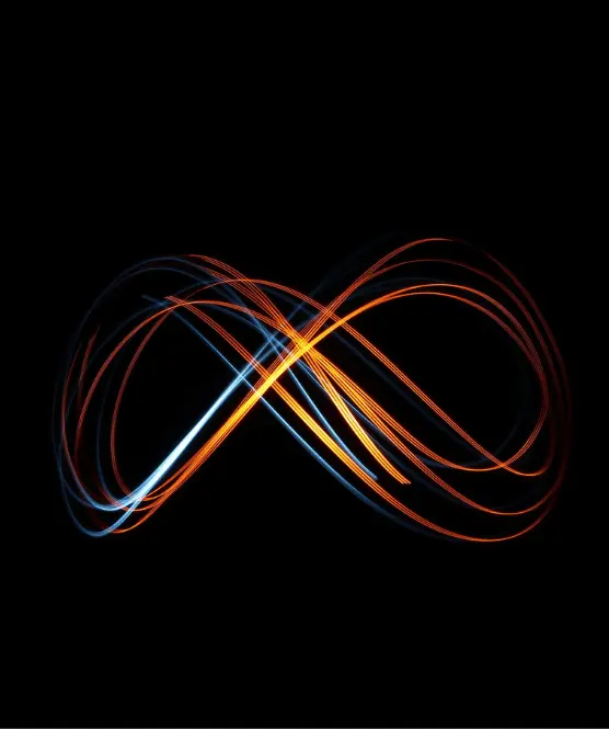 Swirls of light making an infinity symbol against a black background