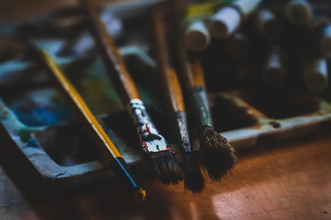 A handful of paintbrushes.