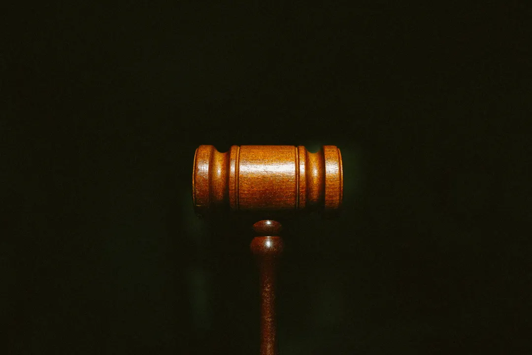 Picture of a gavel on a black background