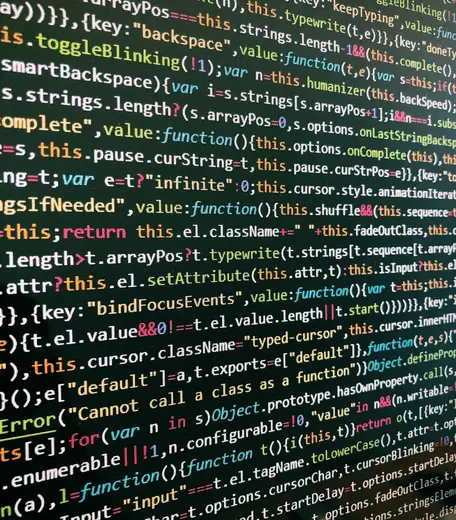 Multicoloured rows of code on a screen