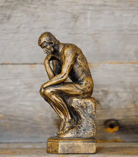 statue of man in thinking pose