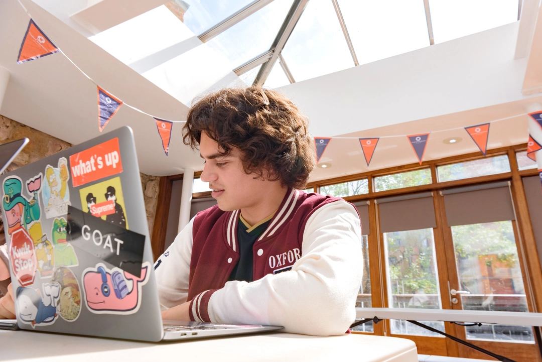 OxBright Computer Science student working on their laptop