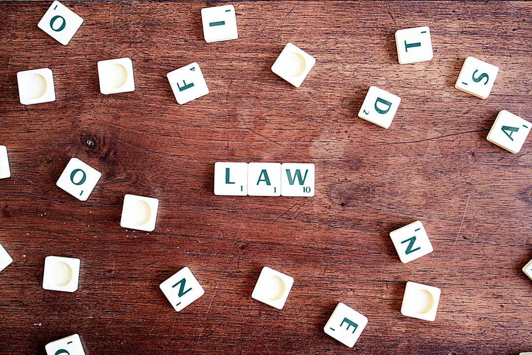 Word tiles spelling out "Law" on a table