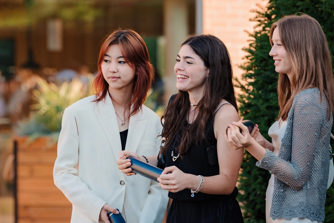 Three high school students at their graduation