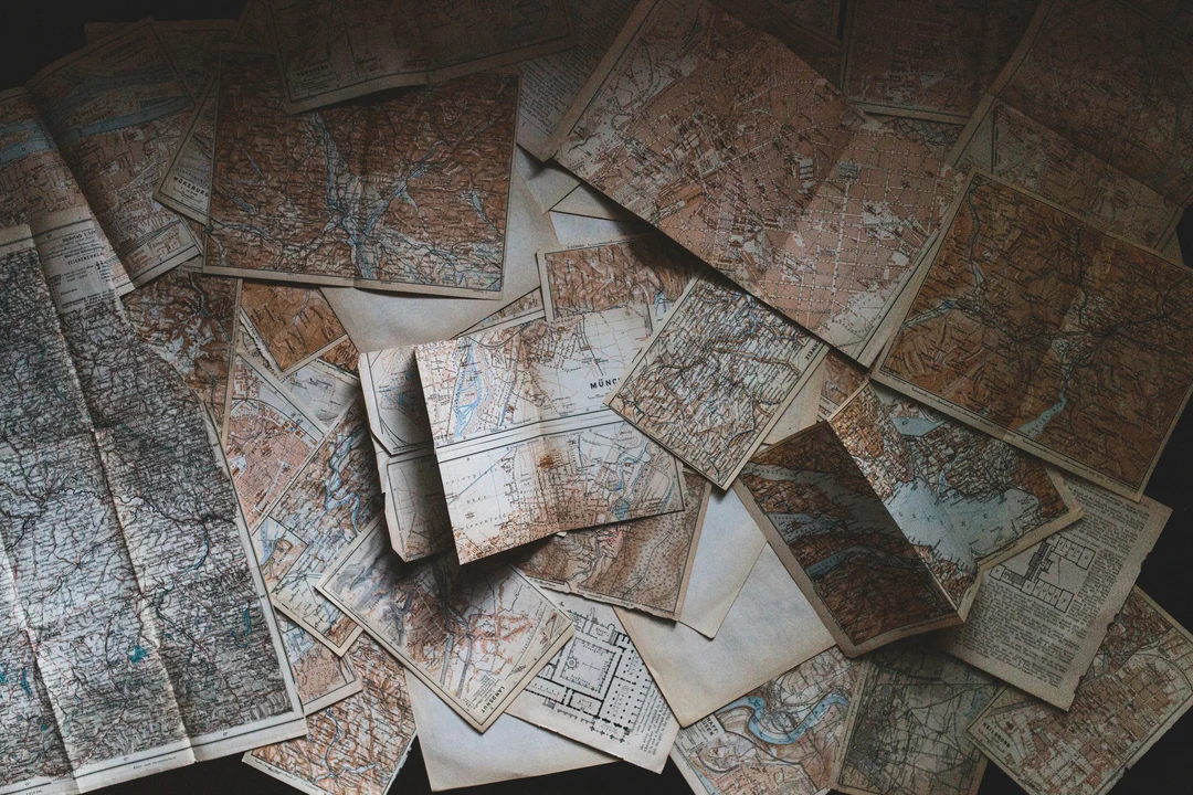 Variety of maps laid out on a table