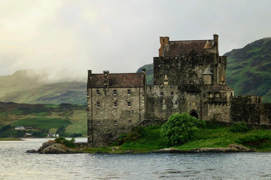 Medieval Scottish castle sitting beside a loch